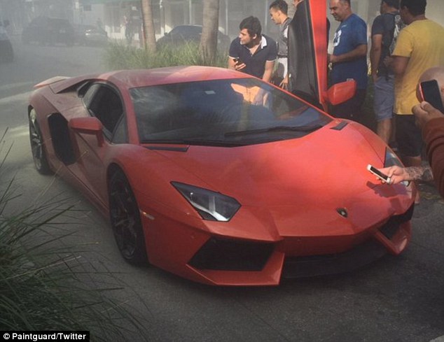 Going nowhere: Others take the opportunity to get up close and personal to the $200,000 car