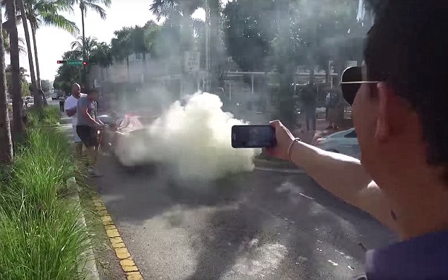 Tourist attraction: Vacationers grab their cameras to shoot video and stills of the unusual sight